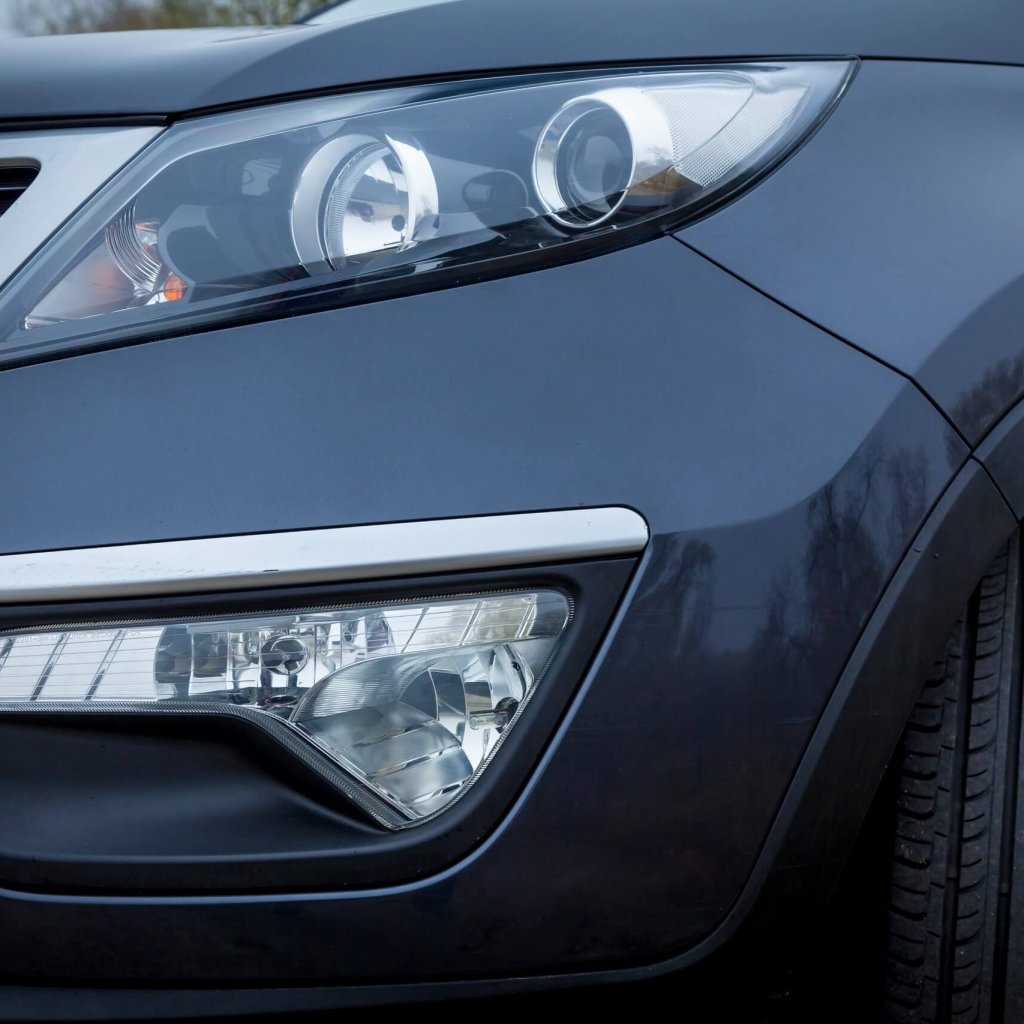 Ukraine Kiev September 24, 2019: Ukraine Kiev September 24, 2019: Kia Sportage 2019 in a black color is parked with enable headlight on the roadside.