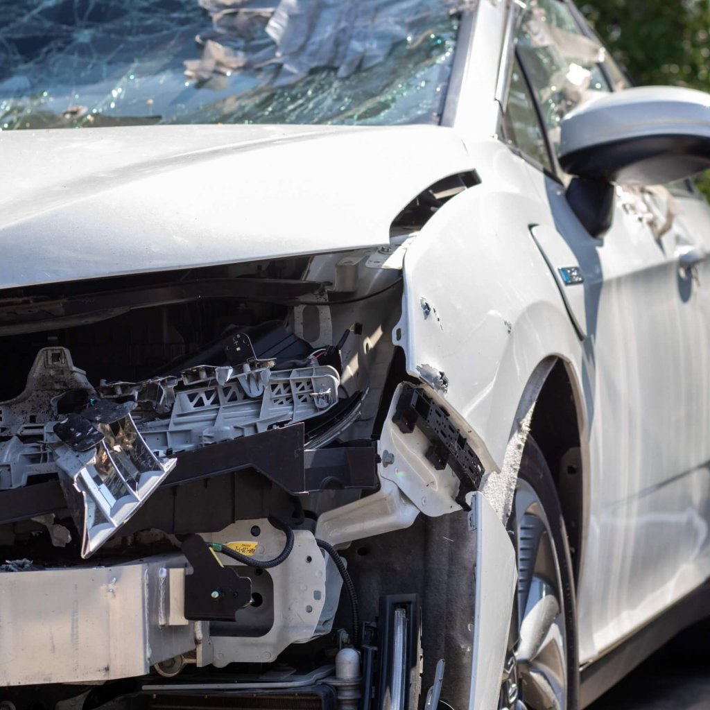 Traffic accident on the street, damaged car after a collision in the city. Accident due to speeding and alcohol intoxication. Transport background. The concept of road safety and insurance